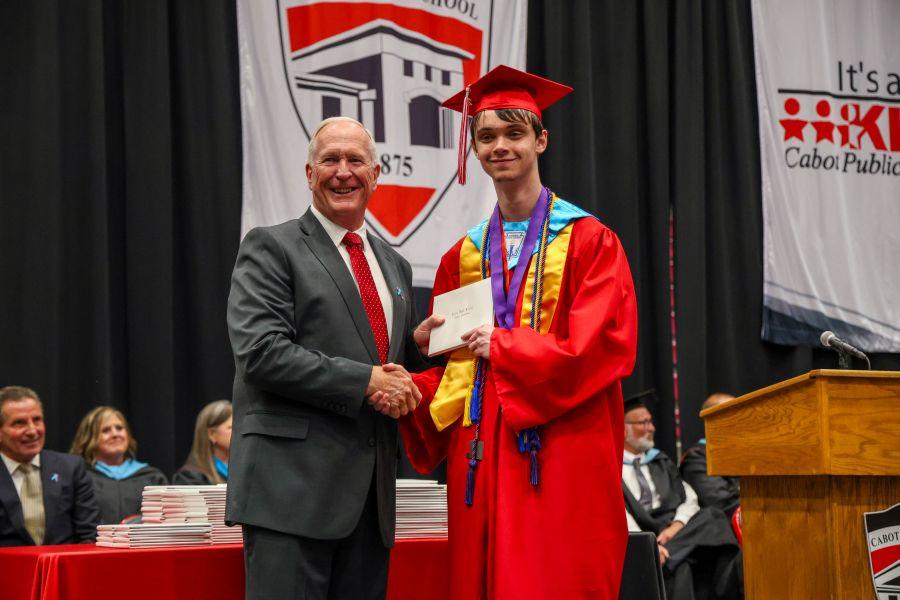 Salutatorian Ramsey Hanley with School Board President Joe Trusty